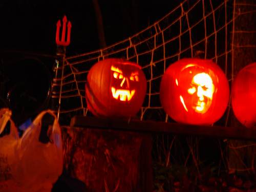 A traditional jack-o-lantern, and a portrait pumpkin of our lovely hostess. 